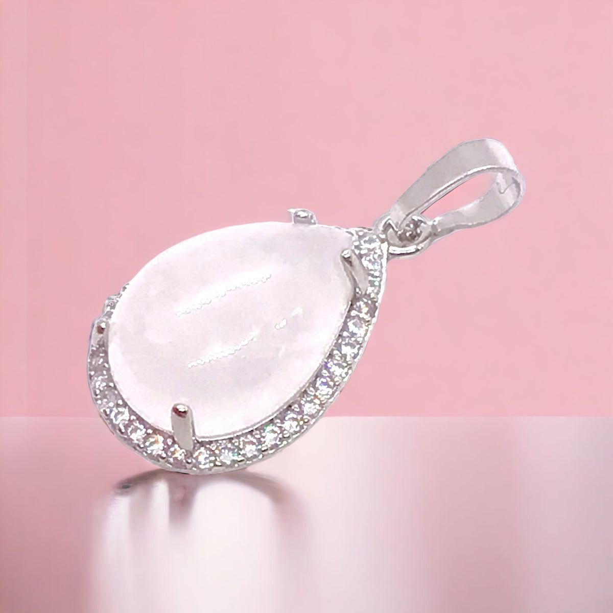 Steinfixx® -  Royale Edelstein Anhänger in Tropfenform, umrahmt von Zirkonia, Edelstahl versilbert